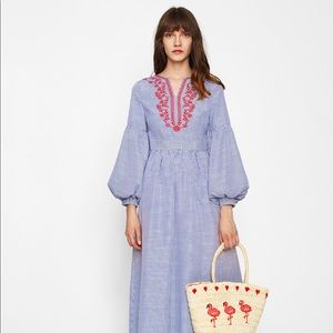 Blue and white maxi dress with red embroidery